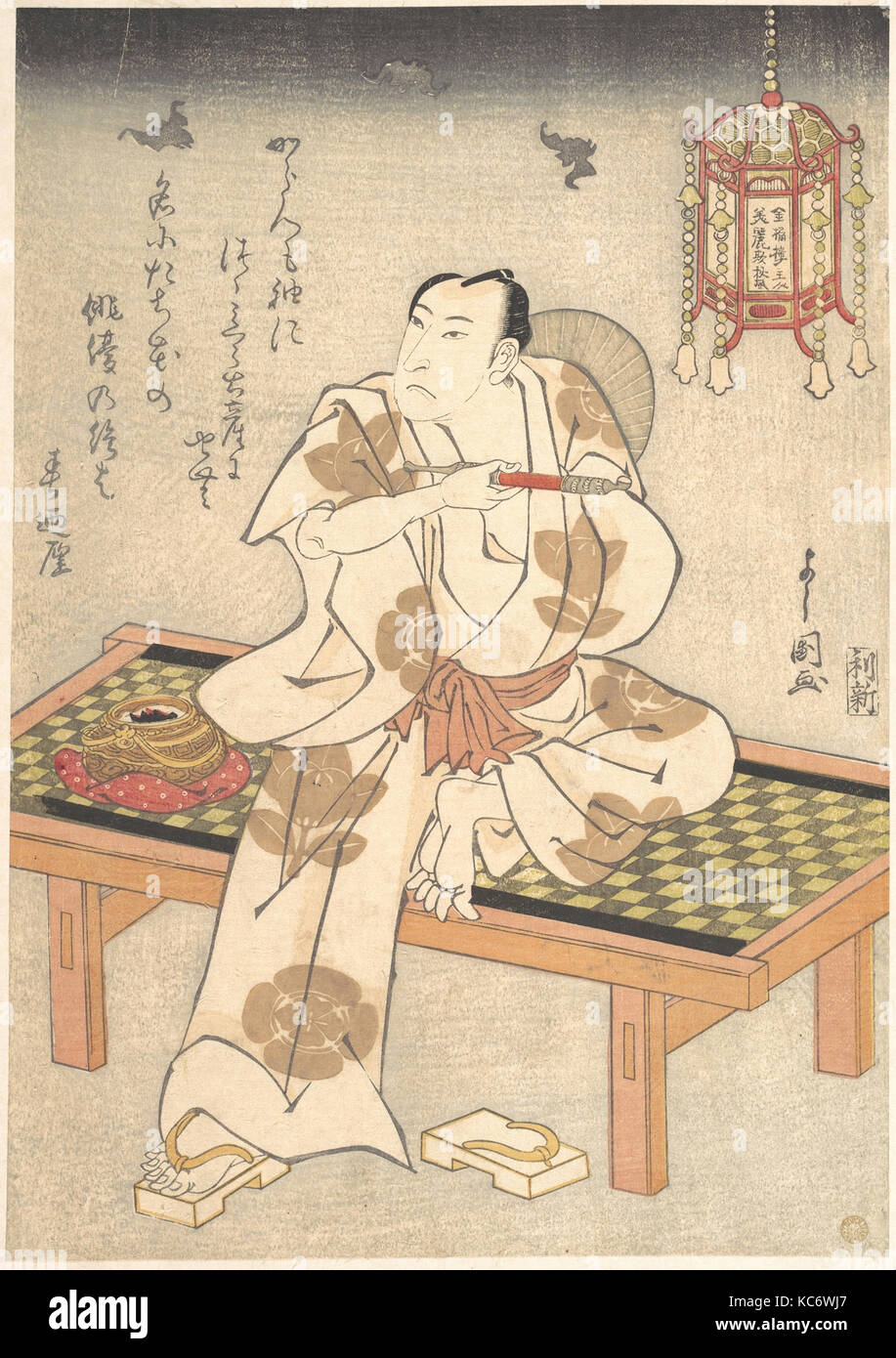 An Actor of the Ichimura Line Sitting on a Shogi (Wooden Bench) and Holding a Pipe, Ippyotei Yoshikuni Stock Photo