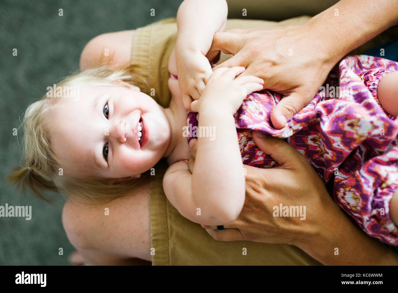 Father playing with baby girl (12-17 months) Stock Photo