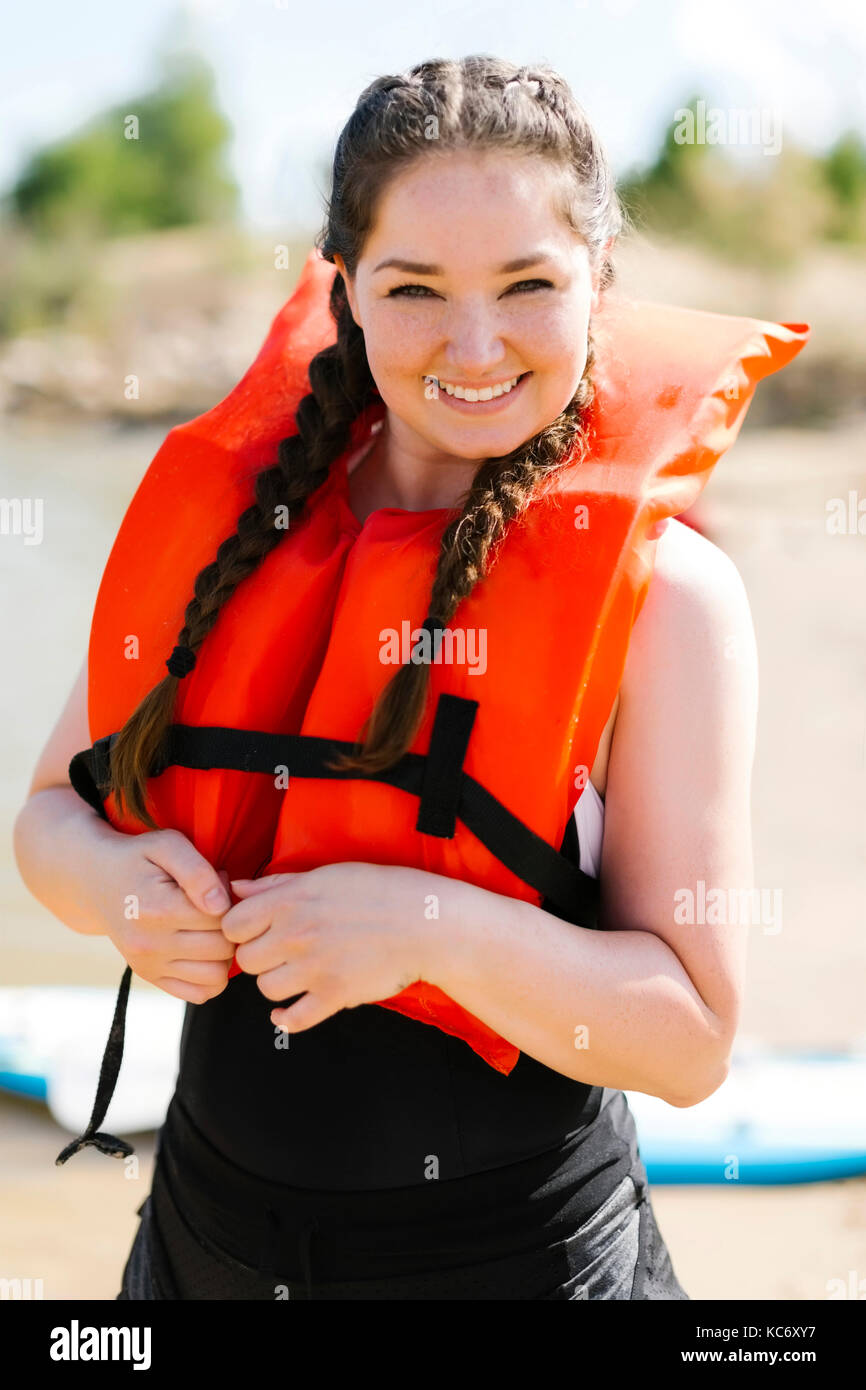 Portrait of smiling woman in life jacket Stock Photo 162422043 Alamy