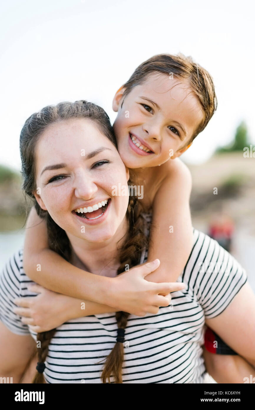 Portrait of smiling mother with son (6-7) Stock Photo