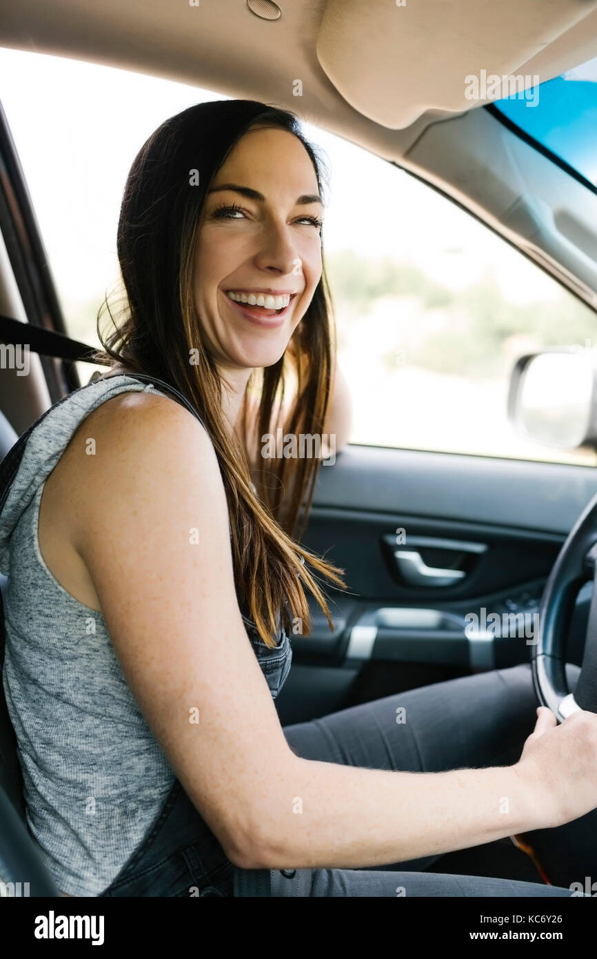 Smiling woman driving car Stock Photo - Alamy