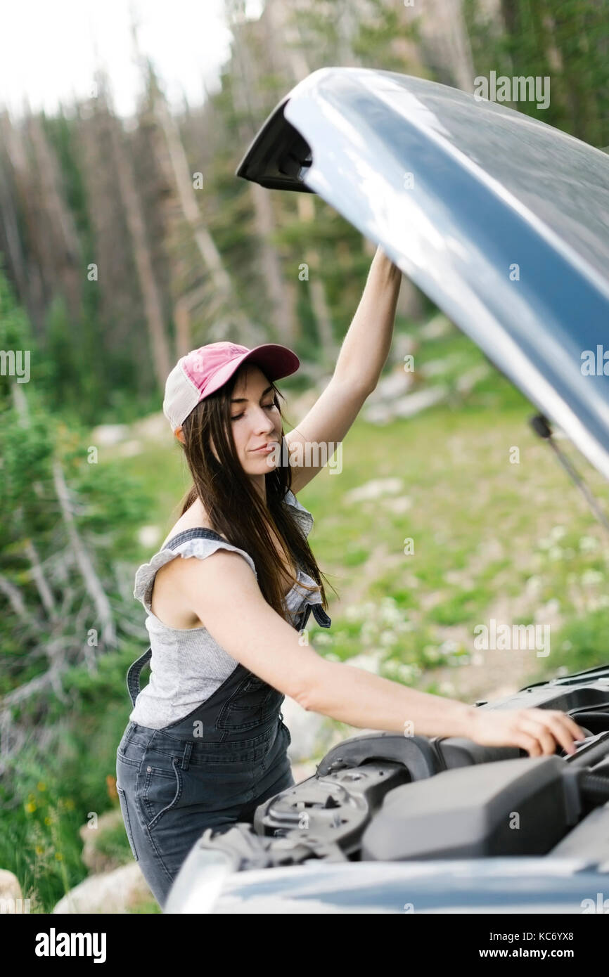 Woman experiencing car problems during trip Stock Photo