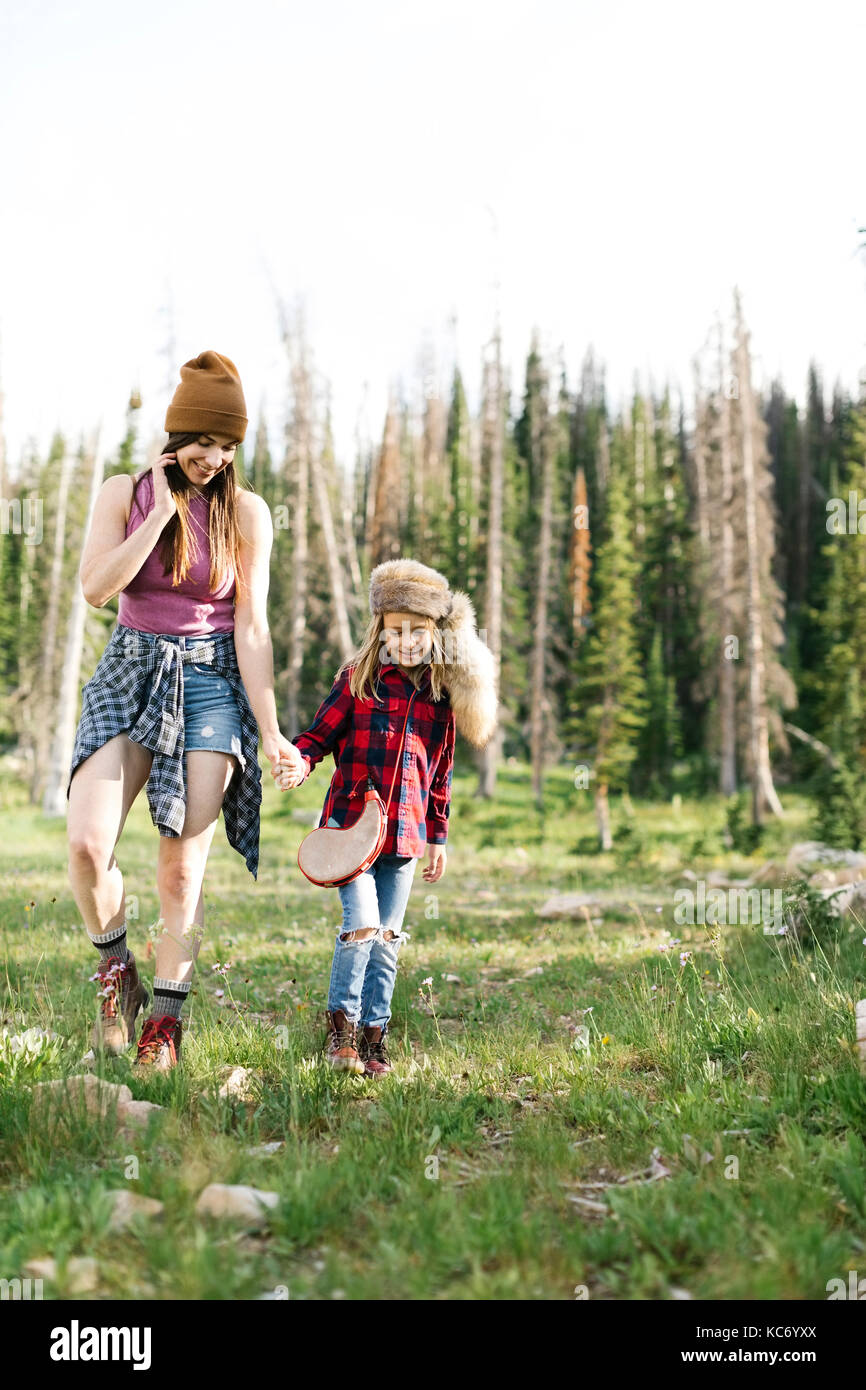 Mother with son (6-7) hiking in forest Stock Photo