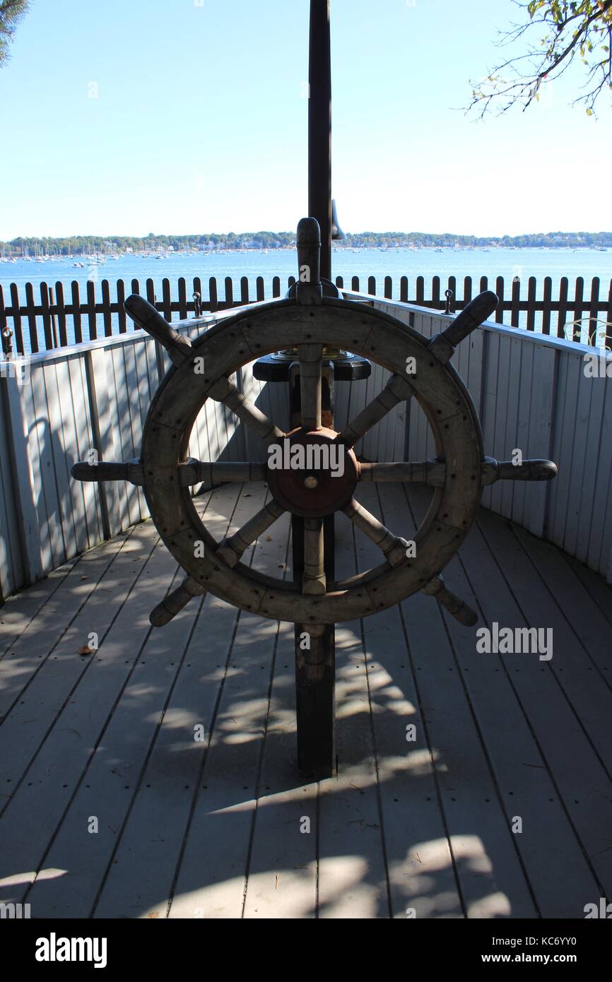 Ship Wheel on Boat Next to the Atlantic Ocean in New England Massachusetts Stock Photo