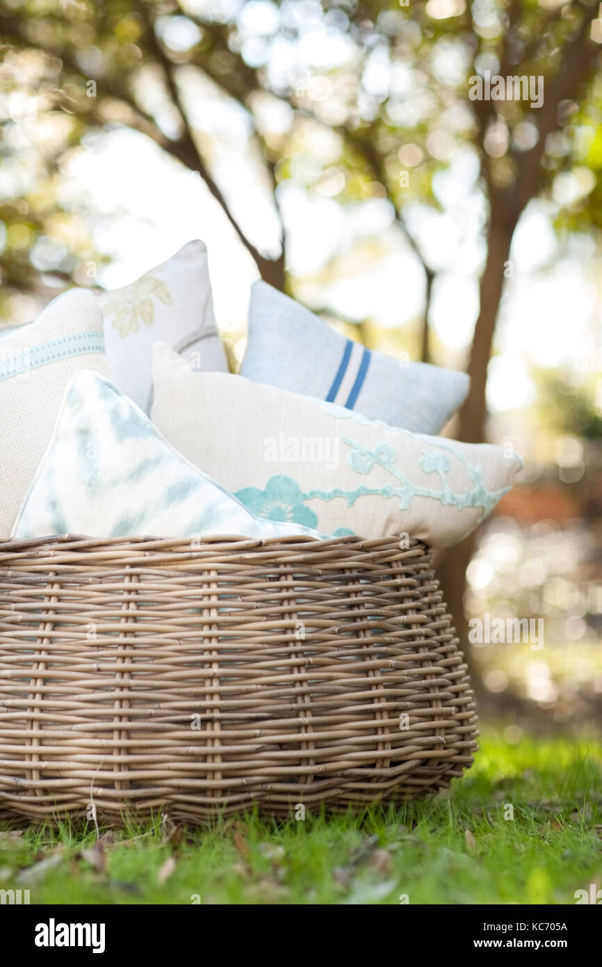 Pillows in basket Stock Photo Alamy