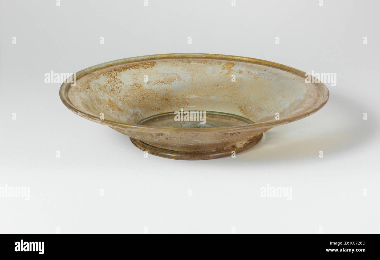 Glass dish, Late Imperial, 4th century A.D., Roman, Glass; blown, Height: 1 1/2 in. (3.8 cm), Glass, Translucent pale blue green Stock Photo
