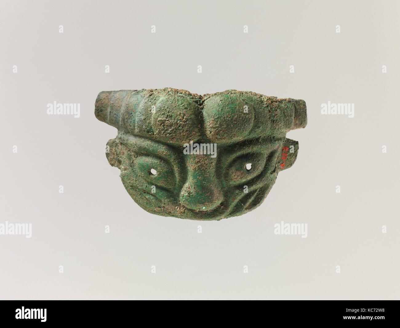 Mask of a Lion, Western Zhou dynasty (1046–771 B.C.), China, Bronze, H. 2 1/8 in. (5.4 cm); W. 3 1/2 in. (8.9 cm), Metalwork Stock Photo