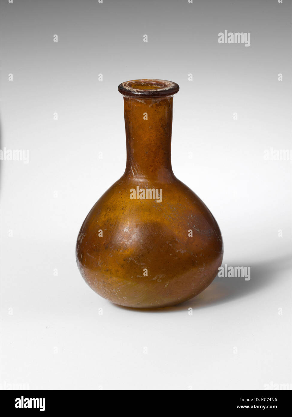 Glass perfume bottle, Early Imperial, 1st century A.D., Roman, Glass; blown, H.: 3 7/16 in. (8.7 cm), Glass, Translucent deep Stock Photo