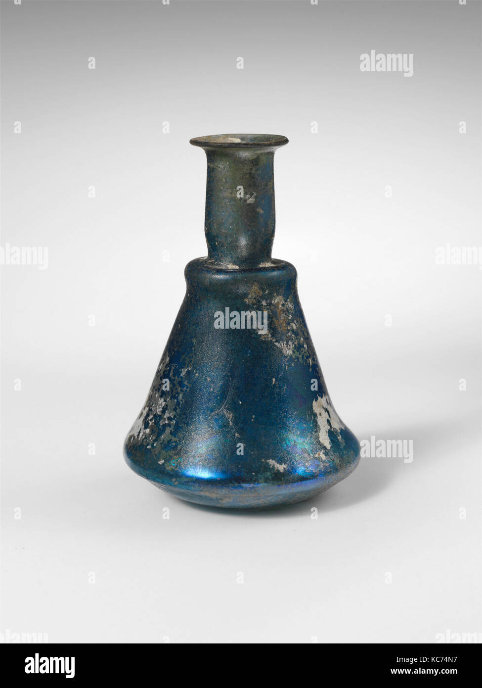 Glass perfume bottle, Early Imperial, 1st century A.D., Roman, Glass; blown, H. 2 3/4 in. (7 cm); width 1 5/16 in. (3.3 cm Stock Photo