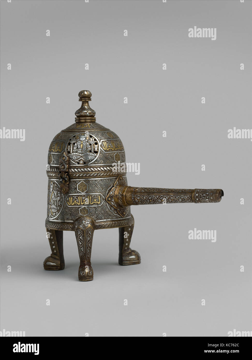 Incense Burner, late 13th–early 14th century, Attributed to Syria, Damascus, Brass; cast with handle made of separately hammered Stock Photo