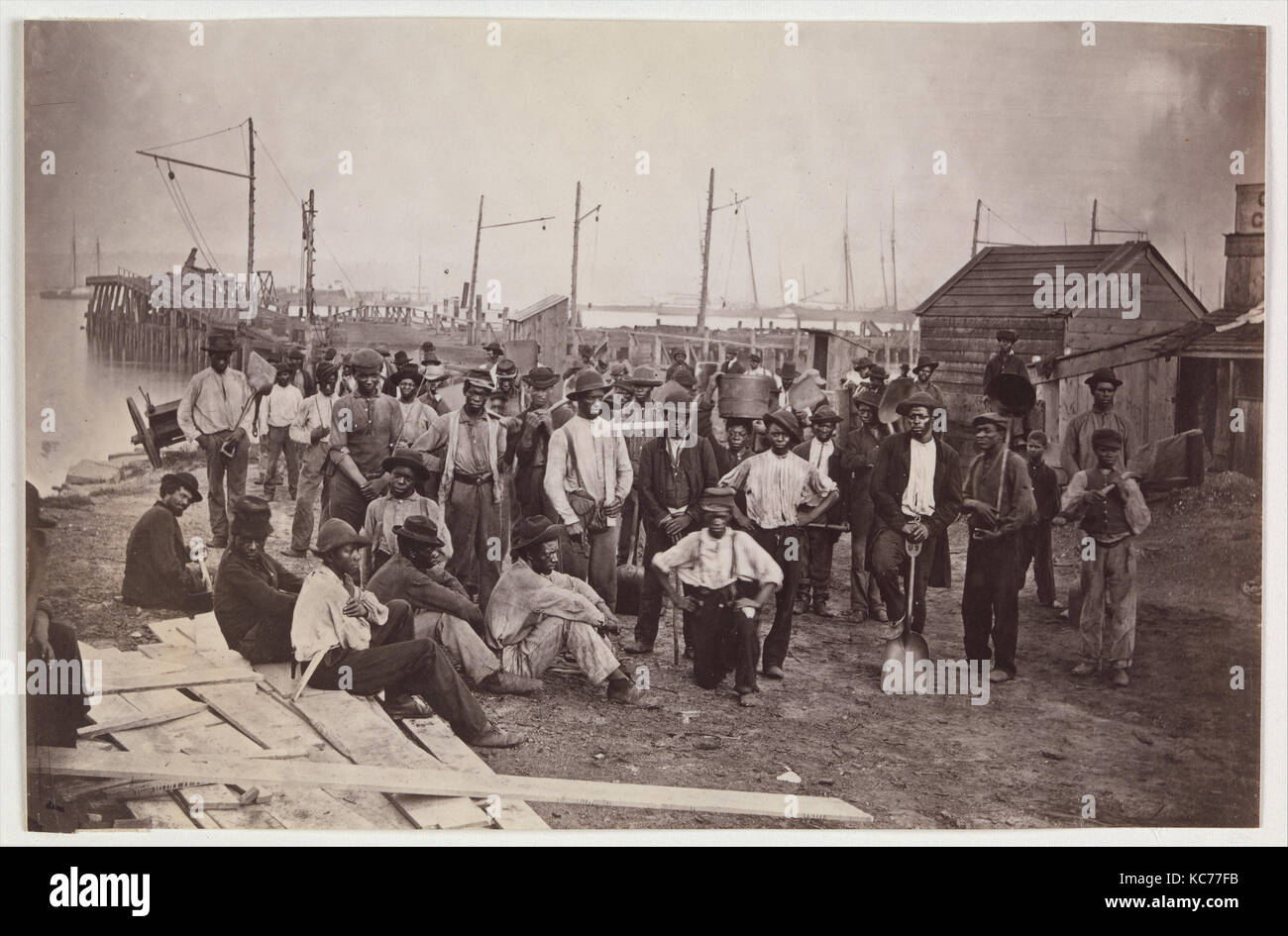 Laborers at Quartermaster's Wharf, Alexandria, Virginia, Attributed to Andrew Joseph Russell, 1863–65 Stock Photo