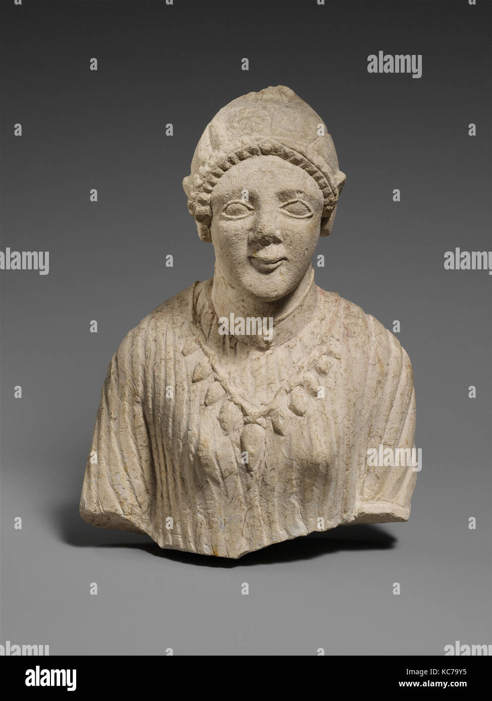 Limestone upper body of a woman, late 6th century B.C Stock Photo