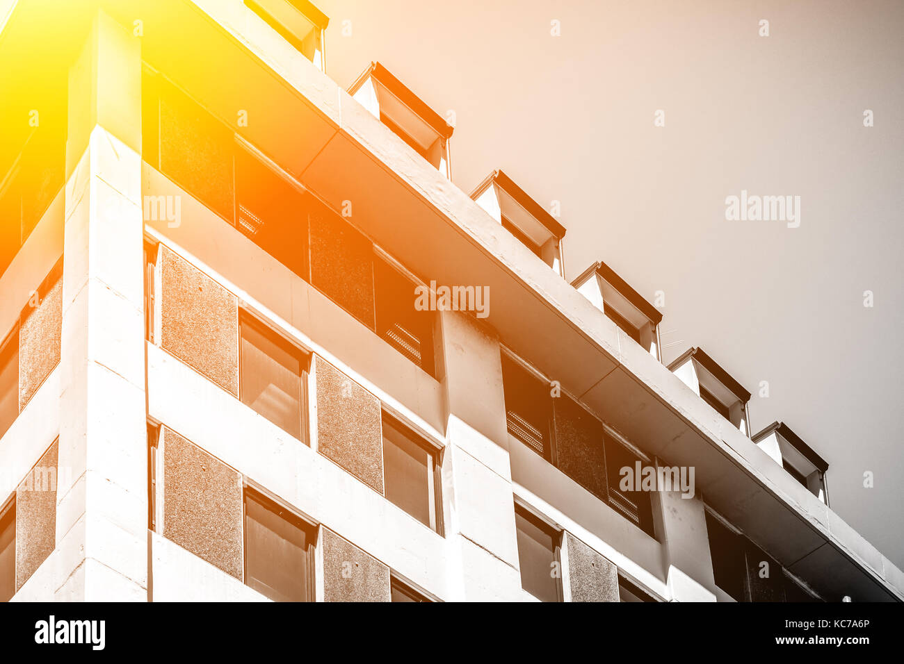 Modern office building close up in sunlight Stock Photo - Alamy