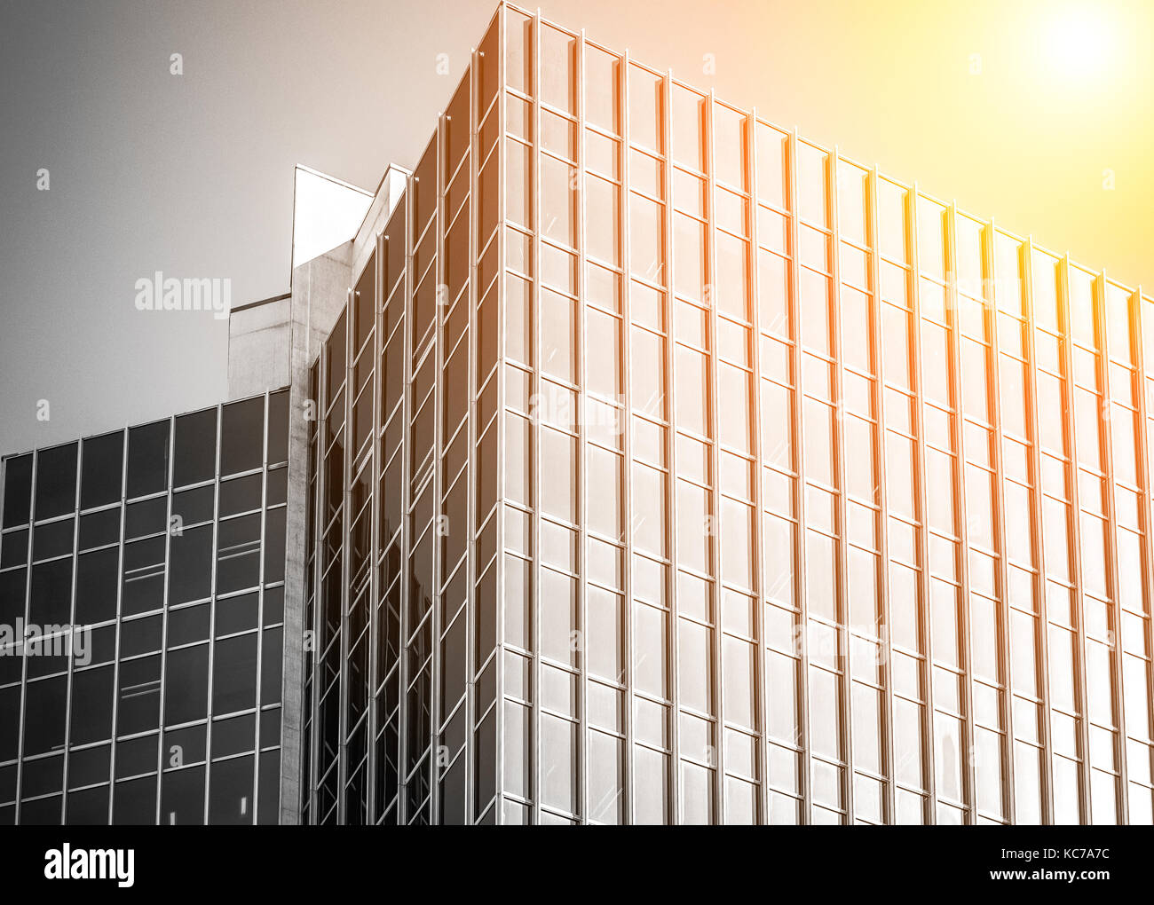 Modern office building close up in sunlight Stock Photo - Alamy