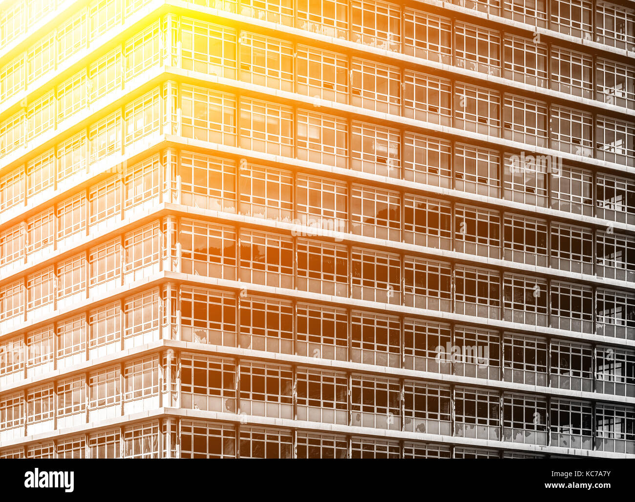 Modern office building close up in sunlight Stock Photo - Alamy