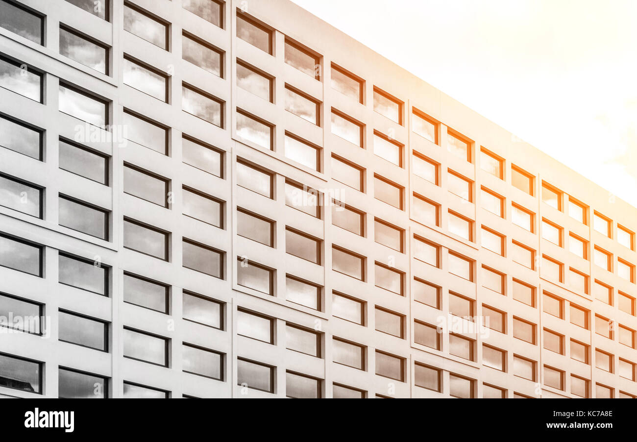Modern office building close up in sunlight Stock Photo - Alamy