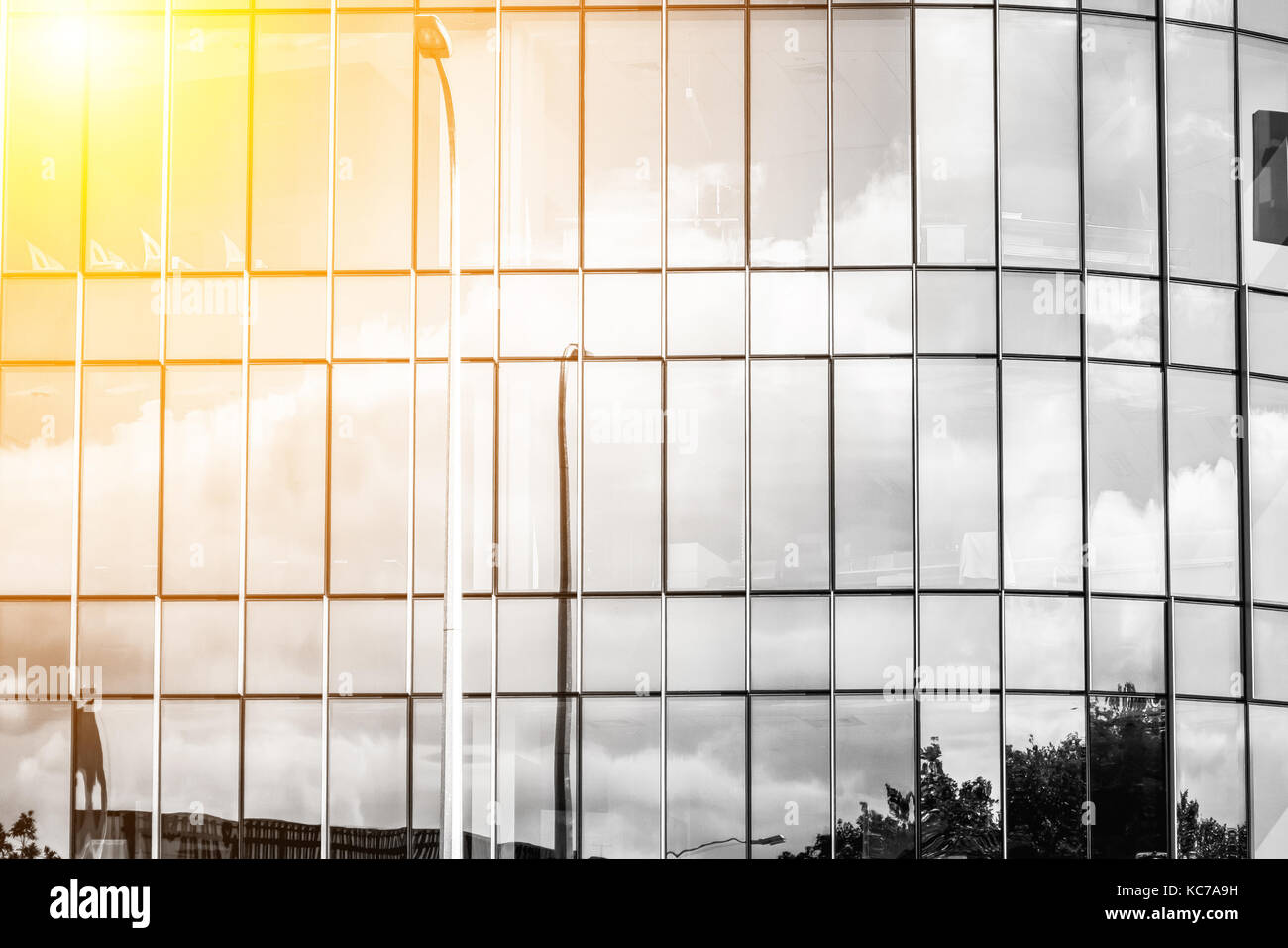 Modern office building close up in sunlight Stock Photo - Alamy