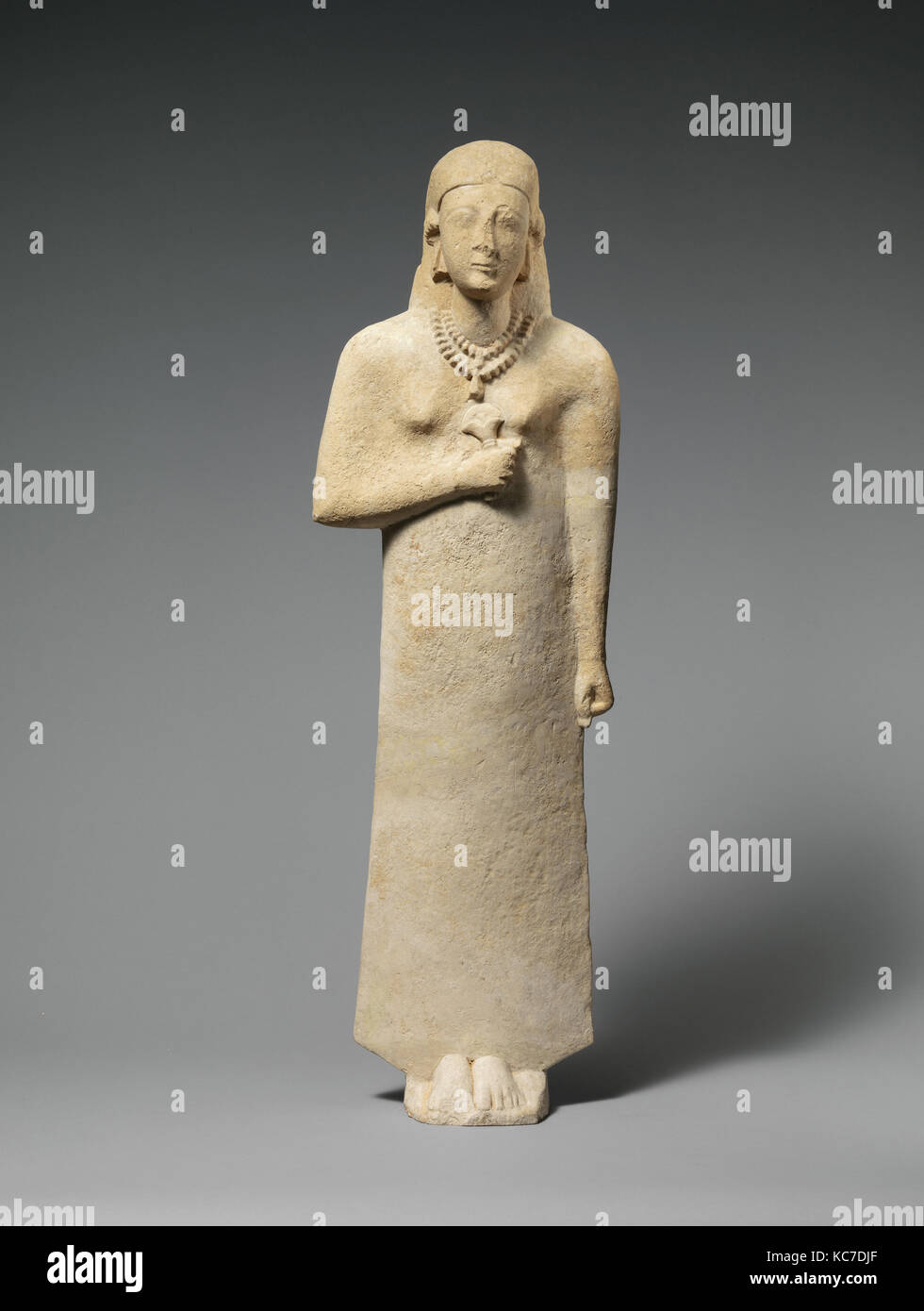 Limestone statue of a woman, early 6th century B.C Stock Photo