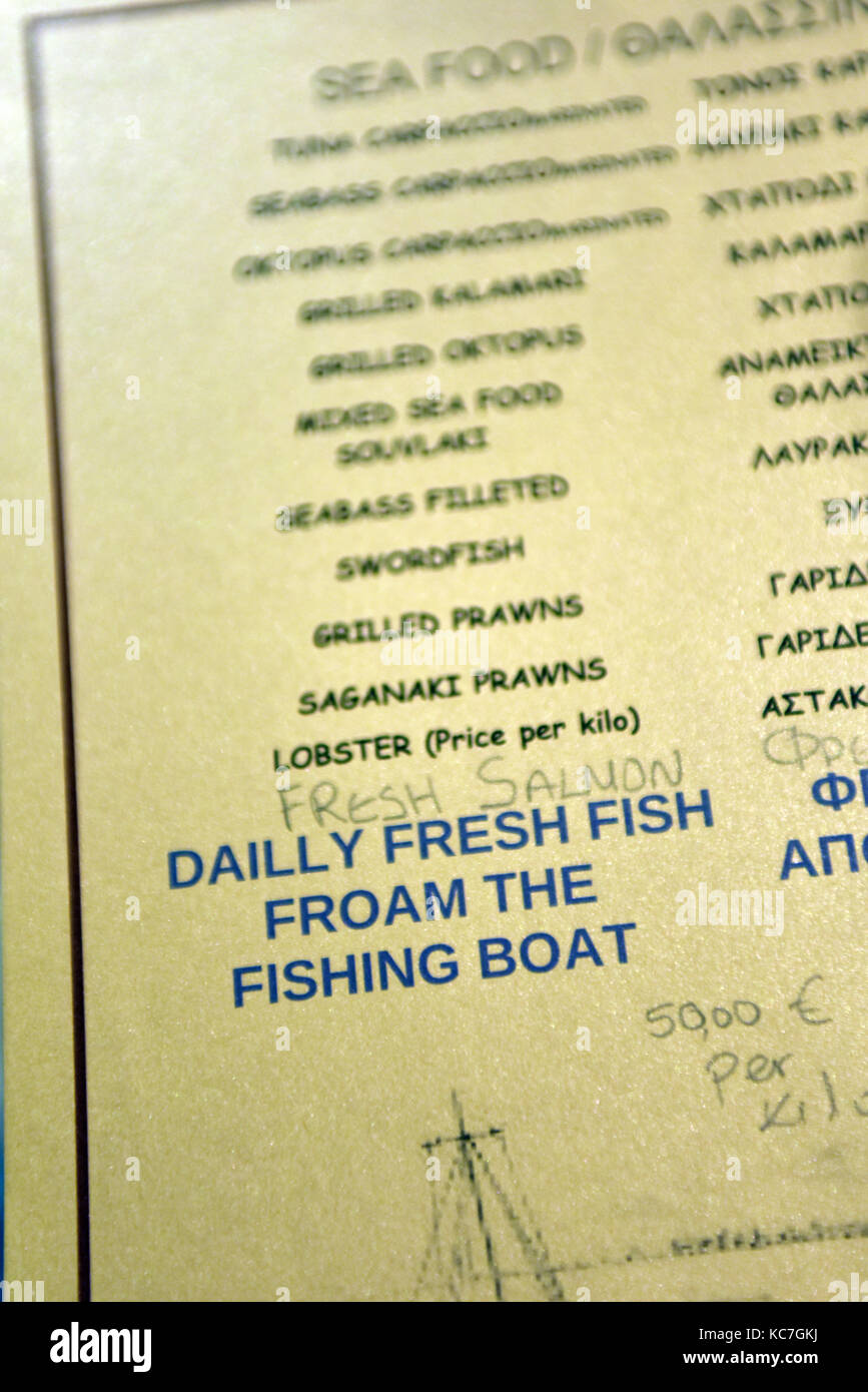 Typographical error or spelling mistake on a greek taverna menu. Fresh froam the fishing boats. Stock Photo