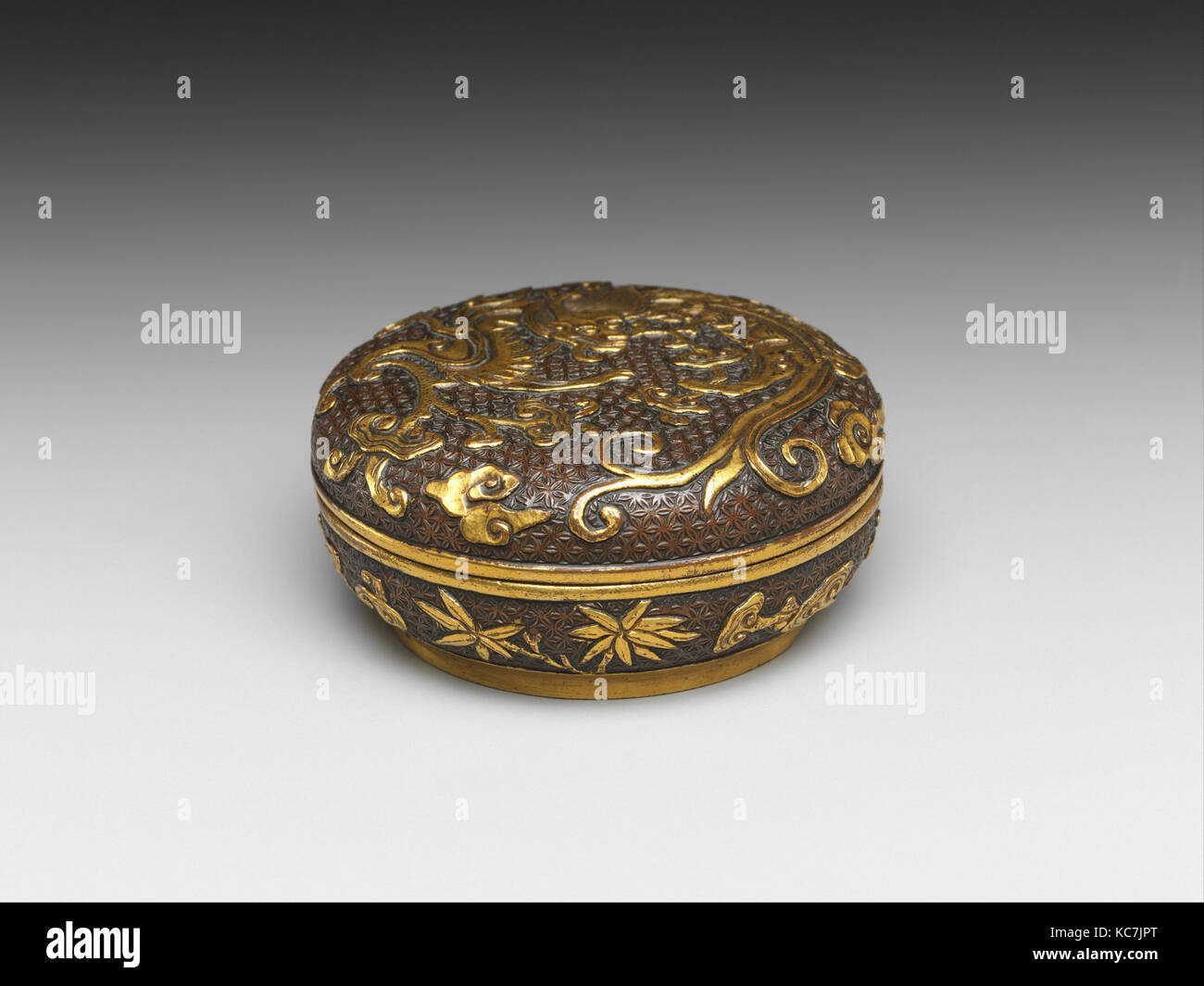 Box, Ming dynasty (1368–1644), 16th–17th century, China, Bronze with gilding, H. 1 1/4 in.; Diam. 2 7/8 in., Metalwork Stock Photo