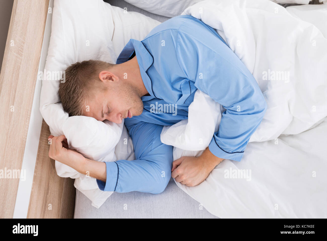 Young Man Sleeping Peacefully At Home In His Bed Stock Photo Alamy