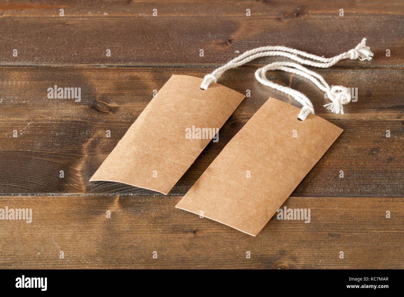 Two blank brown labels with string tags. Empty tags to be used for text or writing signs. Laid