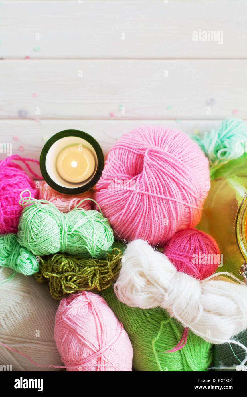 Colored yarn for knitting. Pink and green candlesticks Stock Photo Alamy