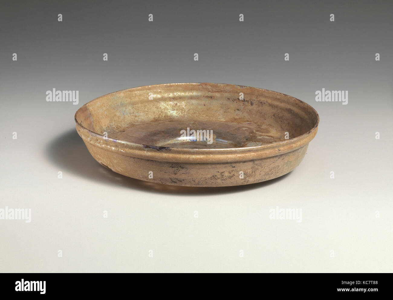 Glass dish, Late Imperial, 4th century A.D., Roman, Glass; blown, H.: 1 1/8 in. (2.8 cm), Glass, Colorless with slight blue Stock Photo