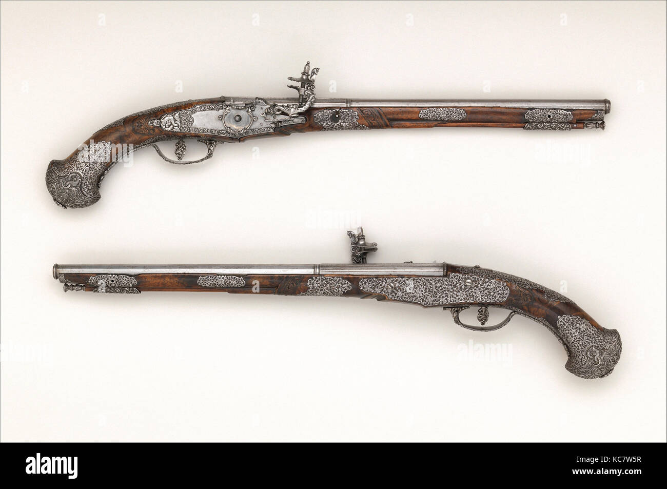 Pair of Wheellock Pistols, mid-17th century, Brescia, Italian, Brescia, Steel, wood (walnut), L. of : 22 11/16 in. (57.7 cm Stock Photo