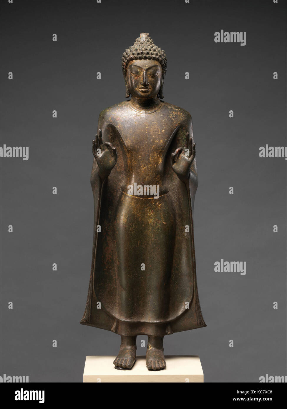 Standing Buddha, Mon-Dvaravati period, 8th–9th century, Thailand (Nakhon Pathom Province), Bronze with traces of gilt, H. 27 in Stock Photo