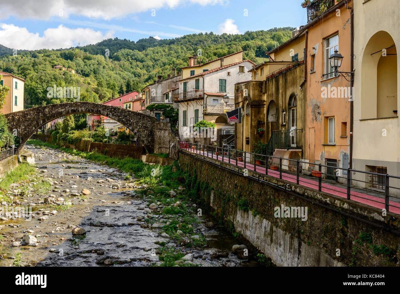 old picturesque stone bridge in inland Ligurian village, shot in bright late summer light at Varese Ligure, Genova, Liguria, Italy Stock Photo