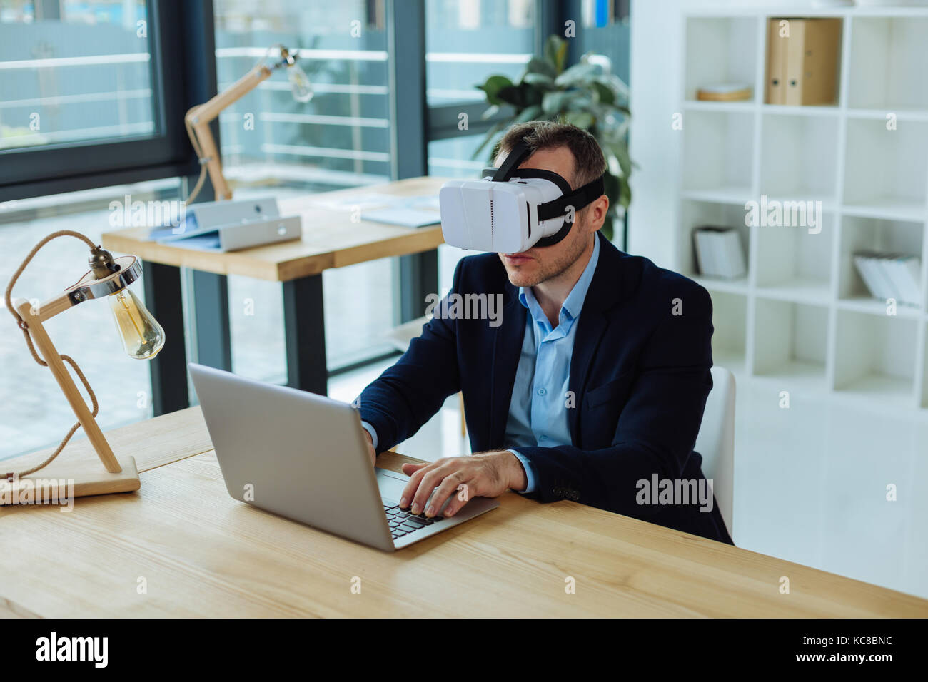 Smart confident man testing new technologies Stock Photo - Alamy