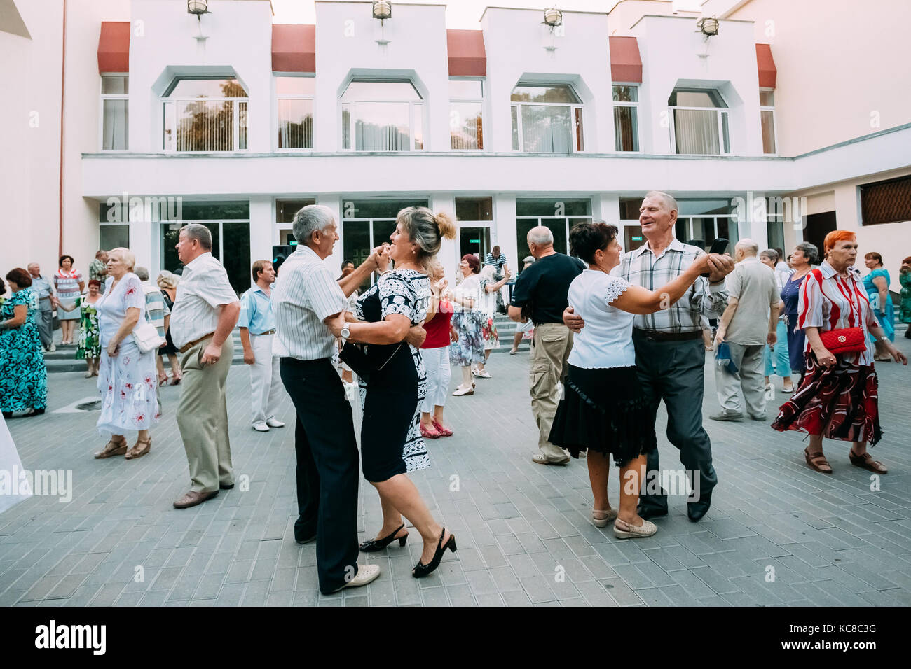 The Elderly People Dancing In Pairs On The Outdoor Dance Floor In ...