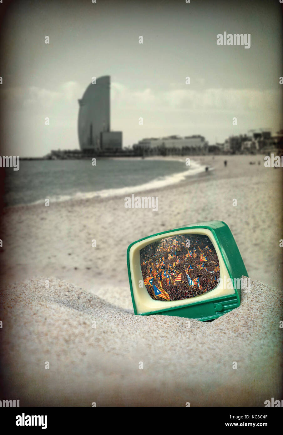 An old television in the beach of Barcelona while manifested people in Catalonia by the Independence Stock Photo