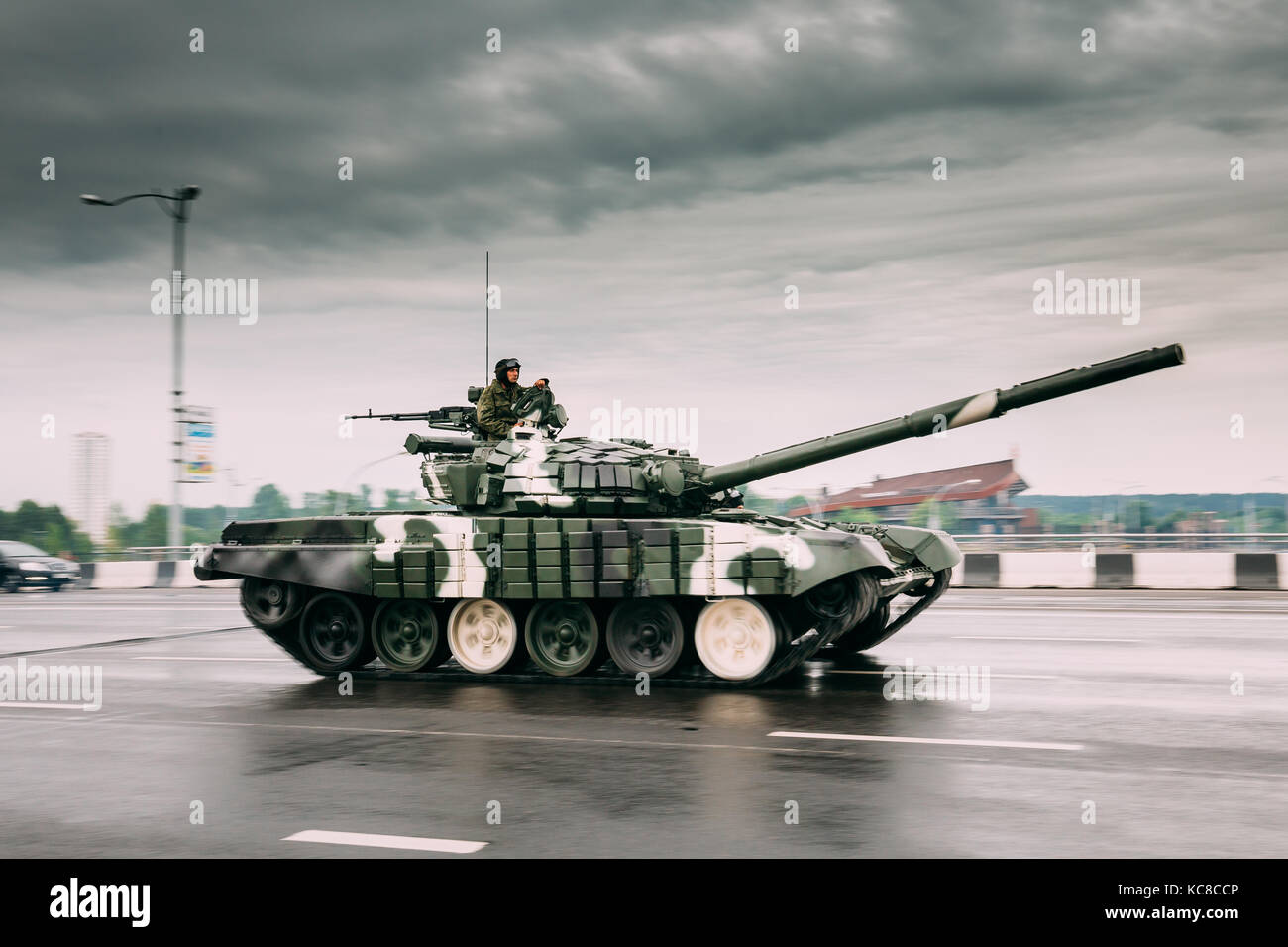 Belarus, Minsk. Military Tank With Tankman Moving Along Street During Training Before Celebration Of The National Holiday - The Independence Day Of Be Stock Photo