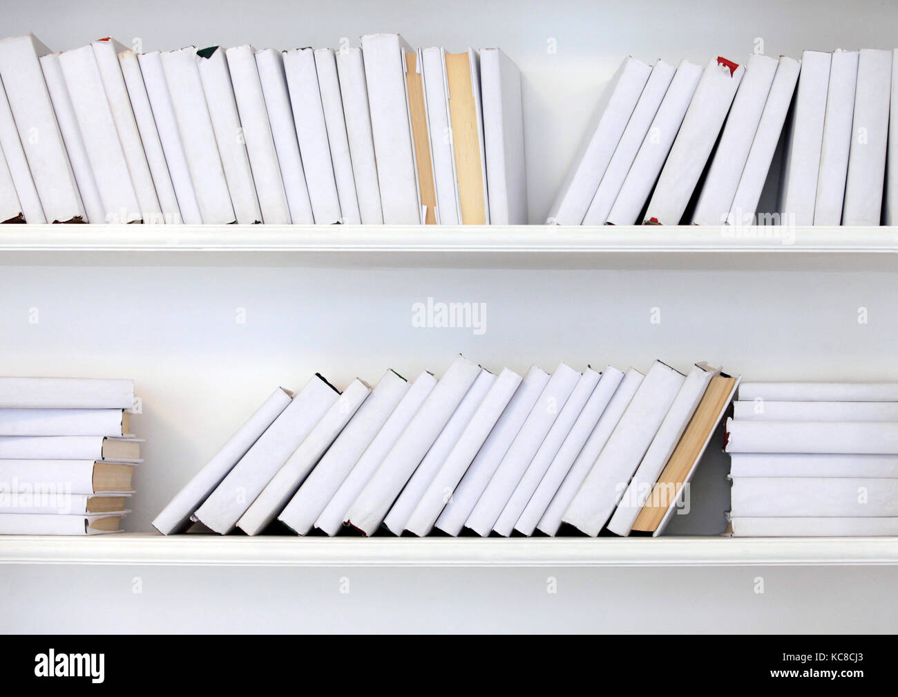 white shelf with books without inscriptions Stock Photo - Alamy