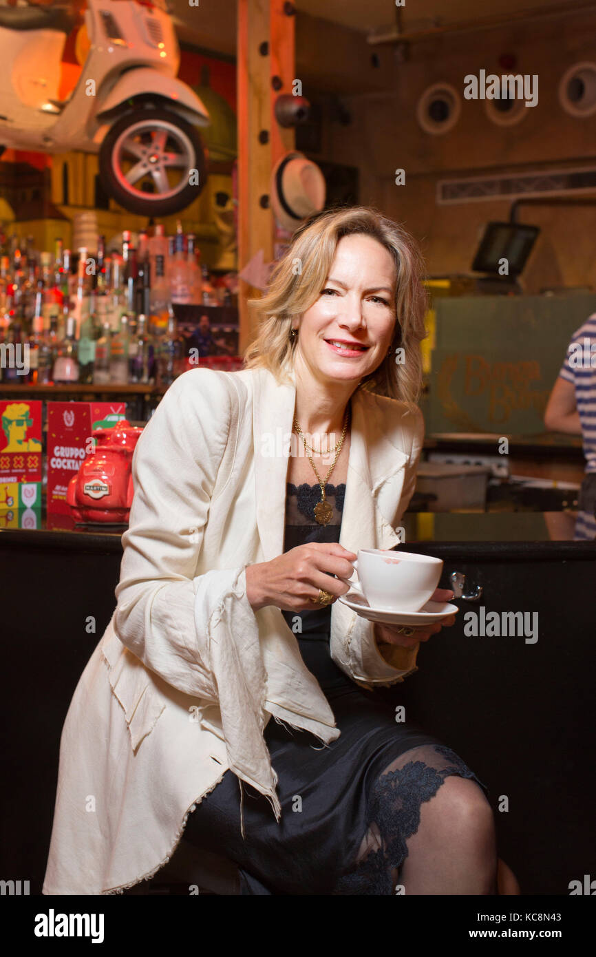 Midlifer Helen Kirwan-Taylor swapping drinking habits at a local bar in London, UK Stock Photo