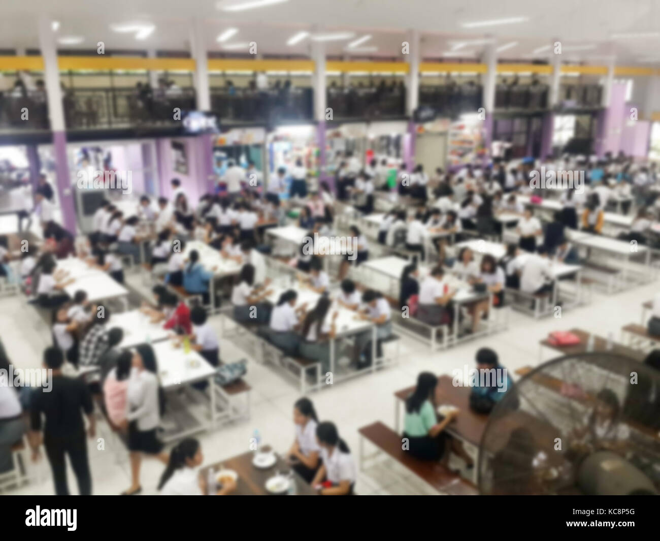 Blur image Canteen Dining Hall Room, A lot of people are eating food in University canteen blur
