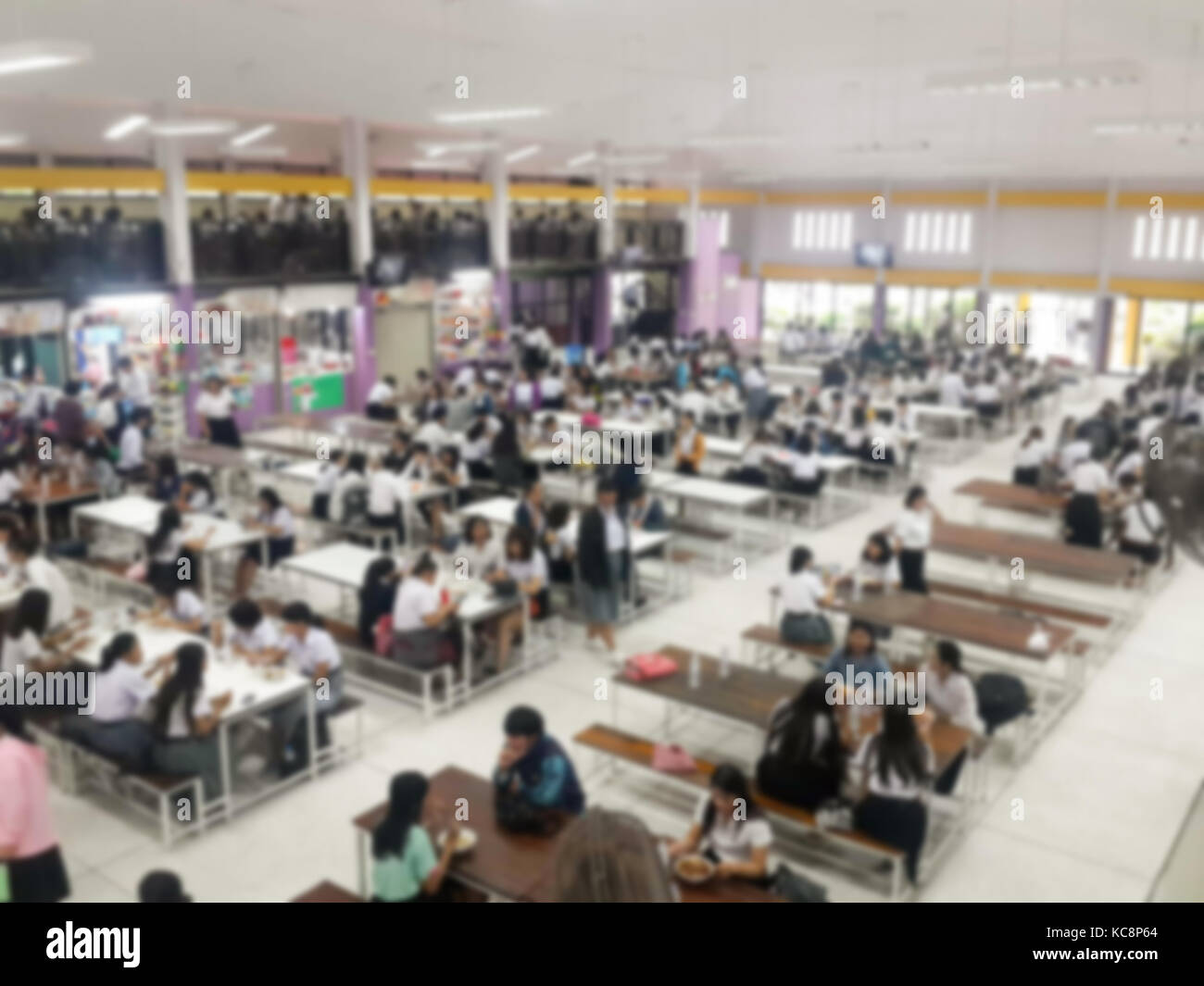 Blur image Canteen Dining Hall Room, A lot of people are eating food in University canteen blur