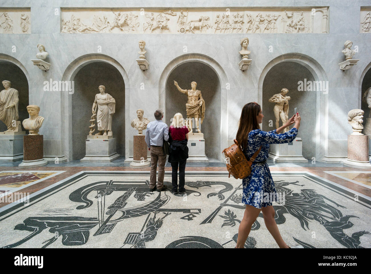 Rome. Italy. Visitors in the Braccio Nuovo Sculpture Gallery, Chiaramonti Museum, Vatican Museums. Musei Vaticani. Stock Photo