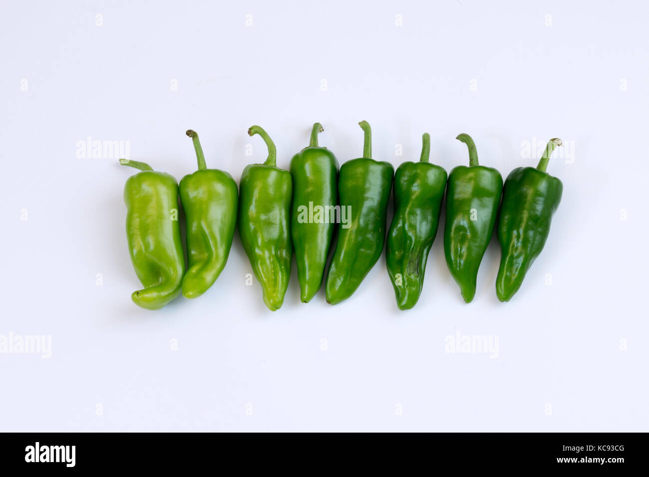 Green peppers on white background Stock Photo - Alamy