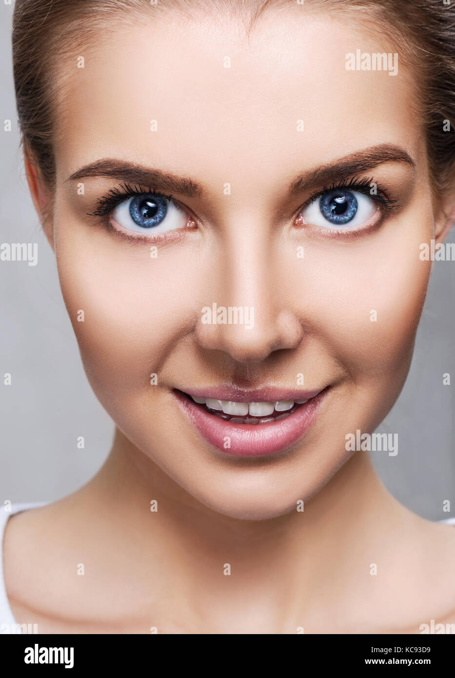 Young woman with perfect skin and makeup. Stock Photo