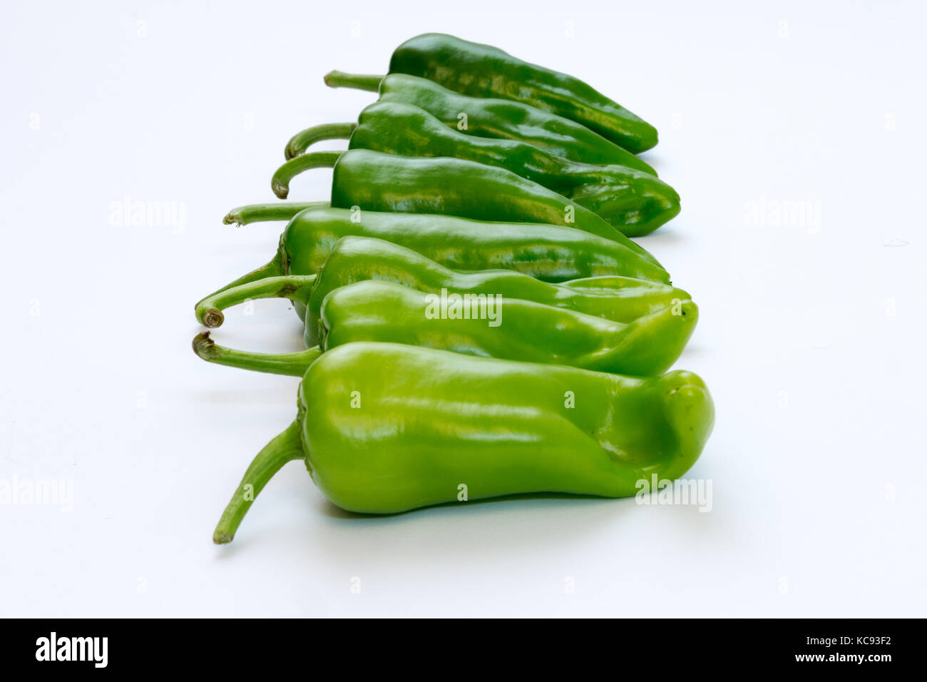 Green peppers on white background Stock Photo - Alamy