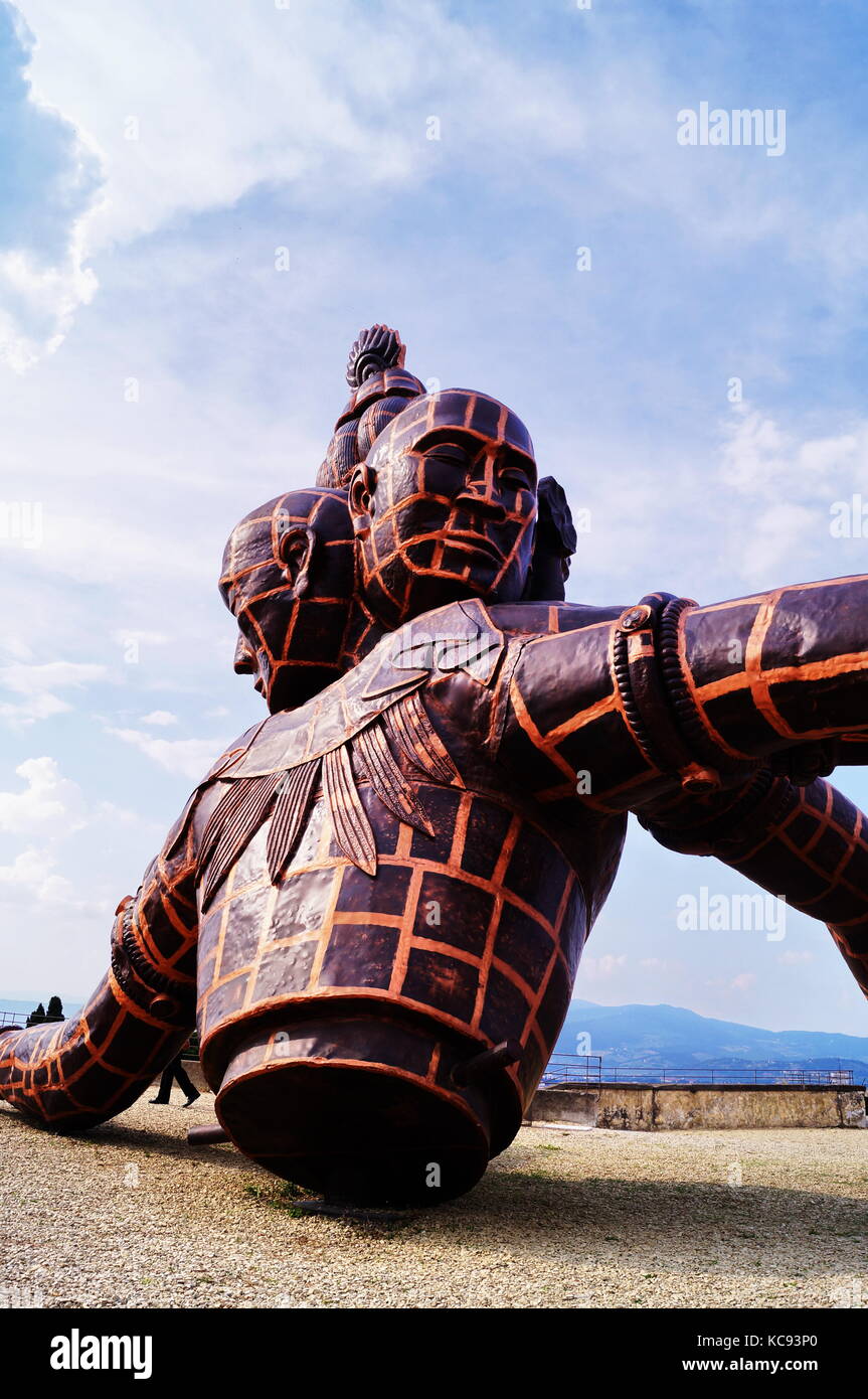 The sculpture entitled Three Heads Six Arms by Chinese artist Zhang Huan located in Forte di Belvedere Florence Italy Stock Photo