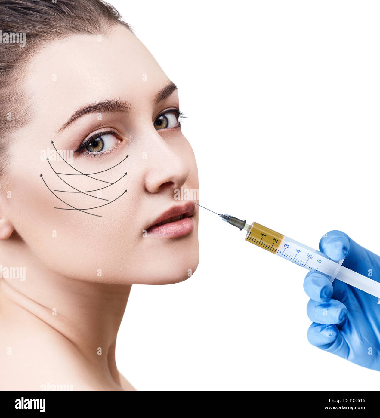 Beautiful woman gets injection in her lips. Stock Photo