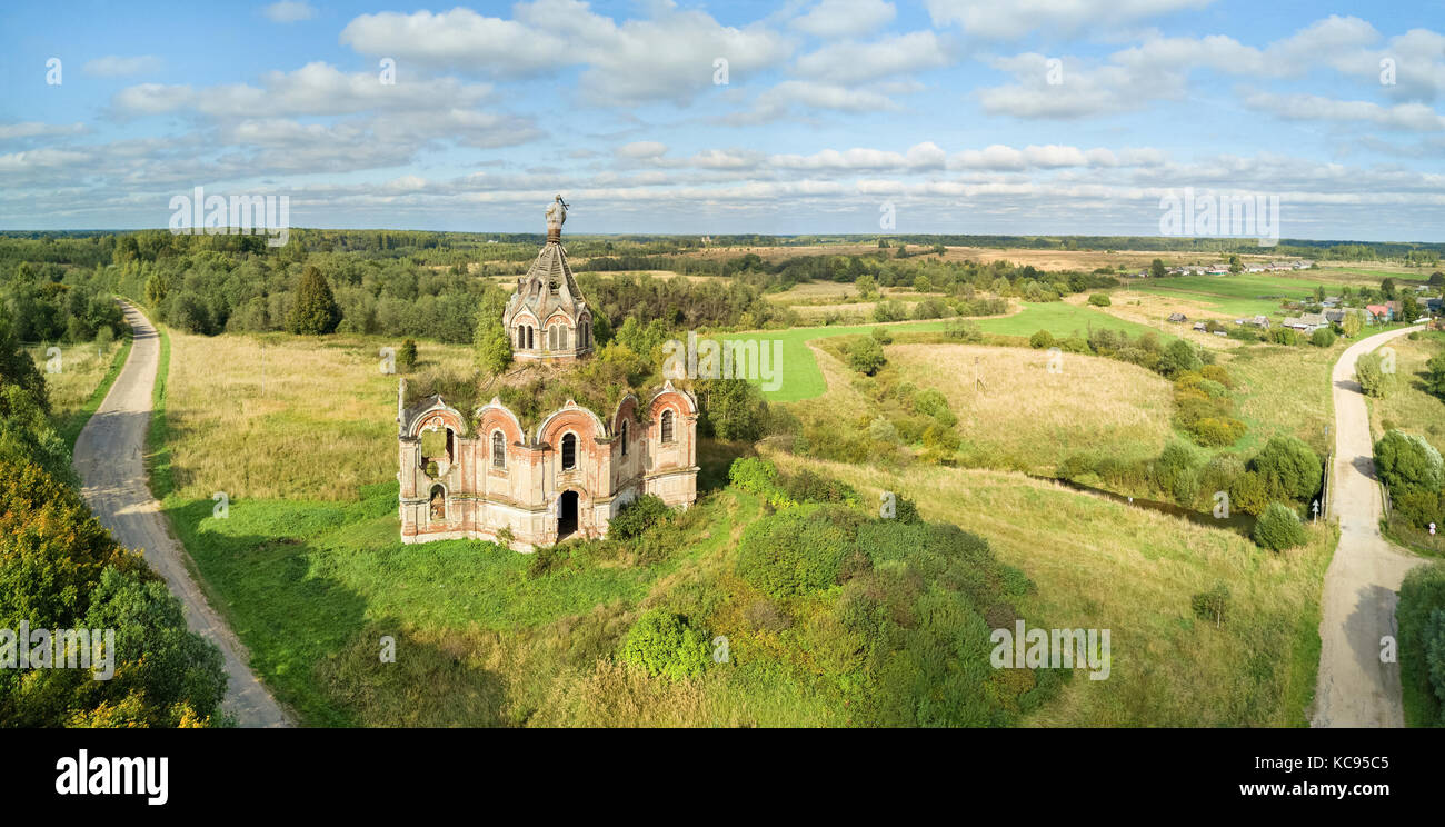 Abandoned church in Guryevo-Voskresenskoye village, Tver oblast, Russia (panoramic aerial view) Stock Photo