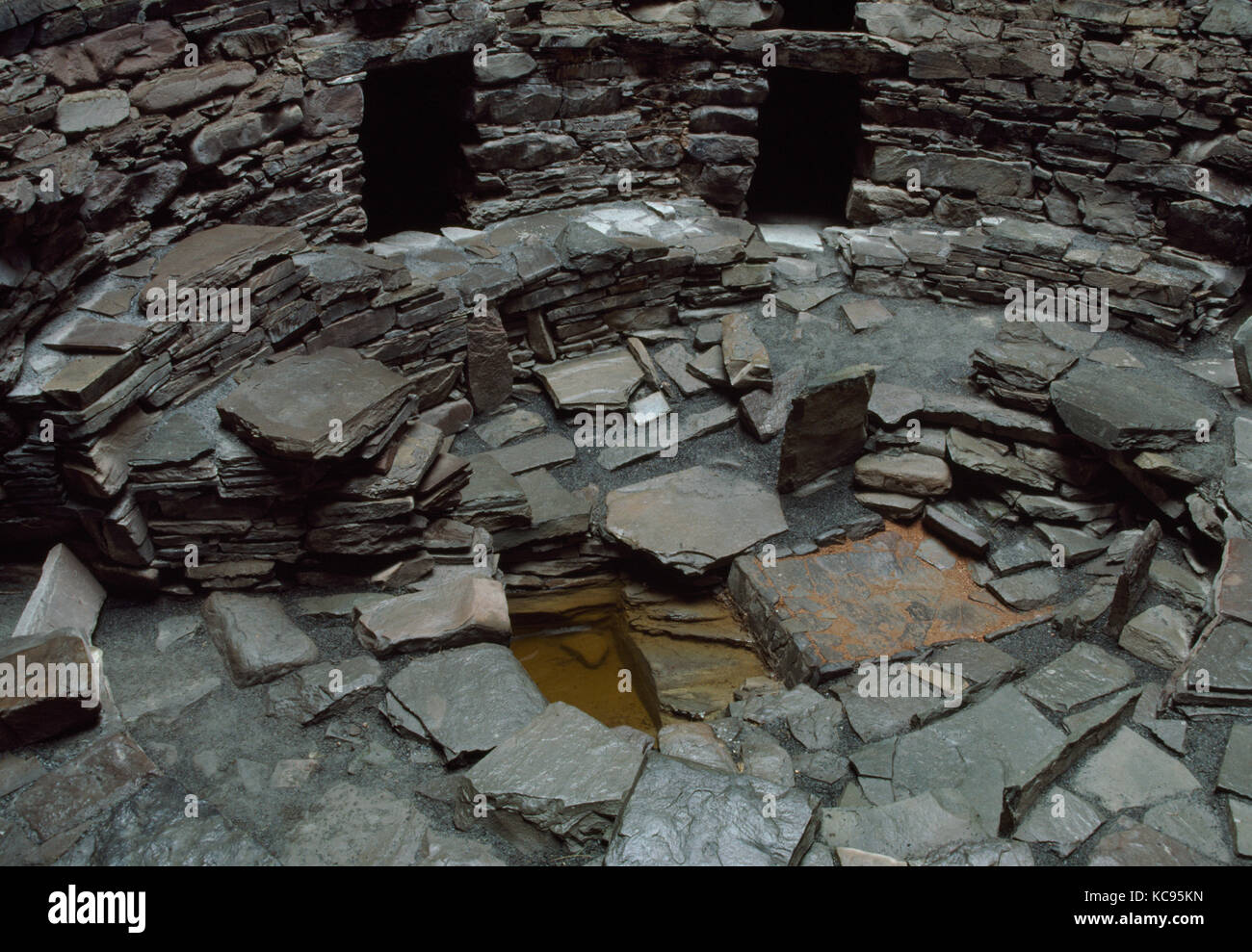 Interior of Mousa Iron Age (1st millennium BC) broch tower, Shetland, showing original ground floor & rock-cut water tank overlain by a wheelhouse. Stock Photo