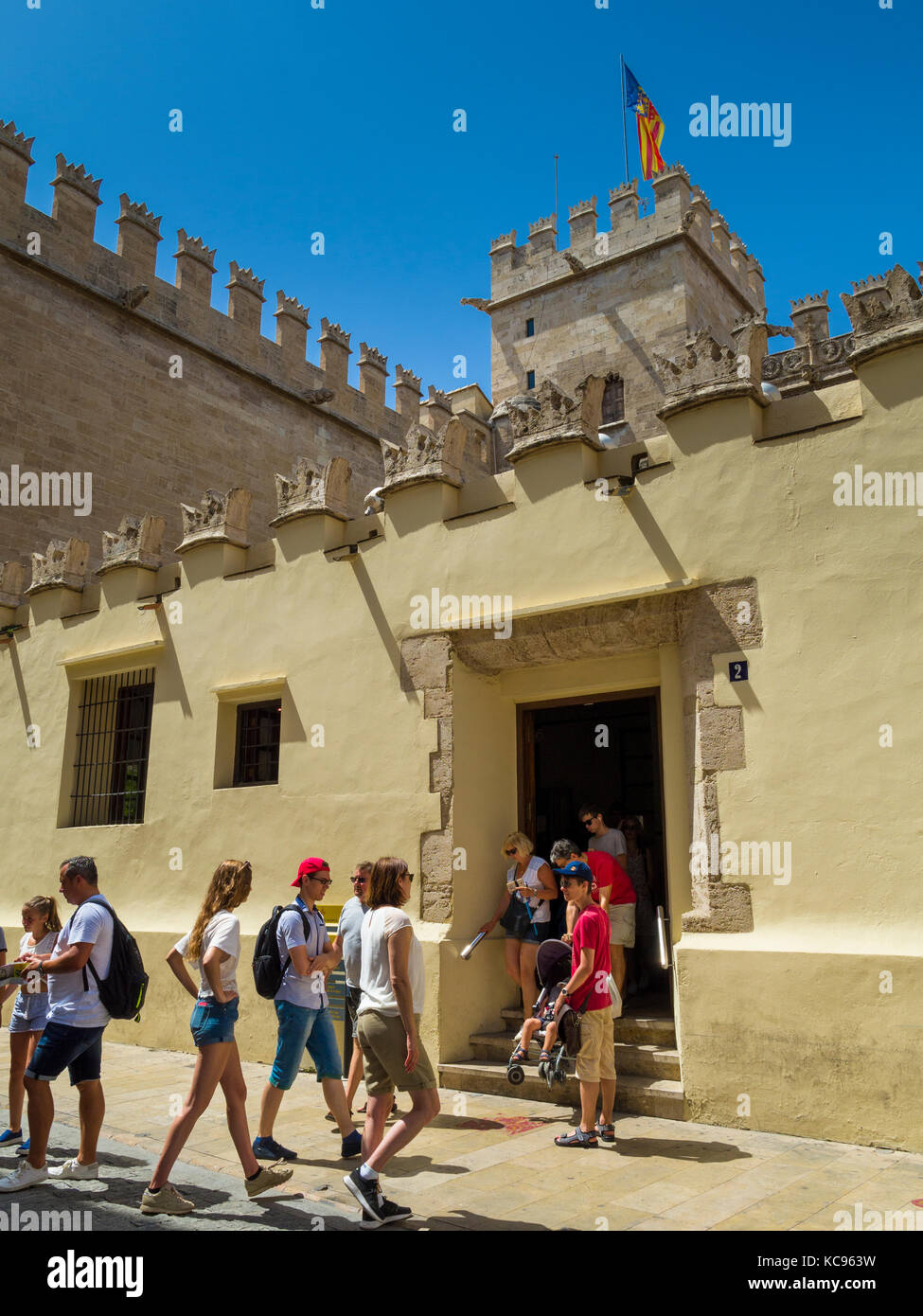 Tourists at La Lonja de la Seda (La Llotja de la Seda) building, Valencia, Spain, Europe. La Lonja de la Seda is a grand medieval building which house Stock Photo