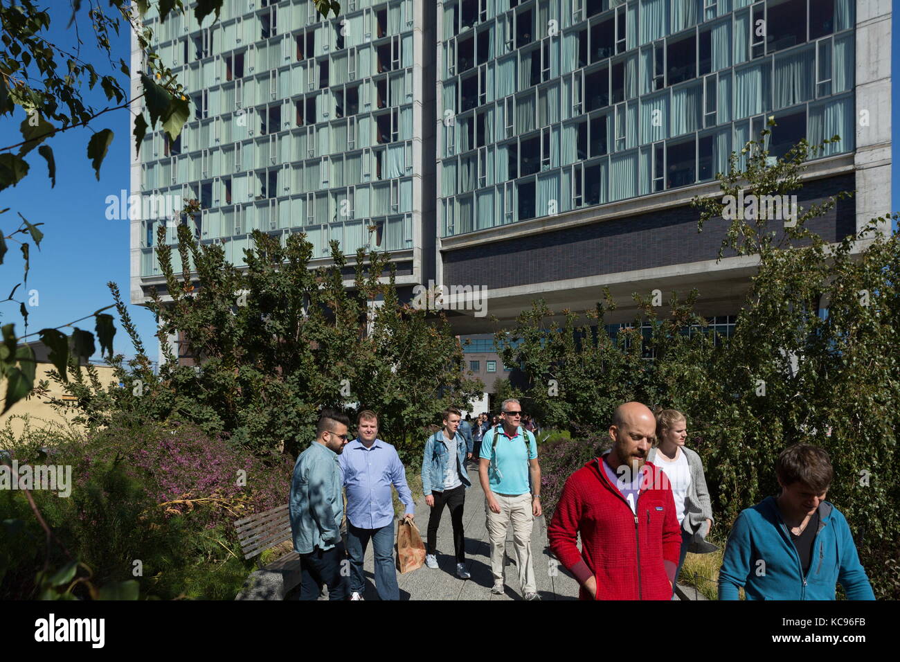 Pedestrians walk along the High Line in New York, New York on October ...