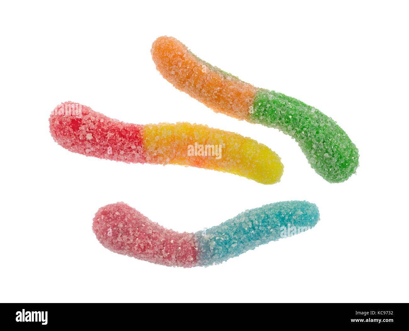 Top view of three sugar coated sour tasting colorful gummy worms